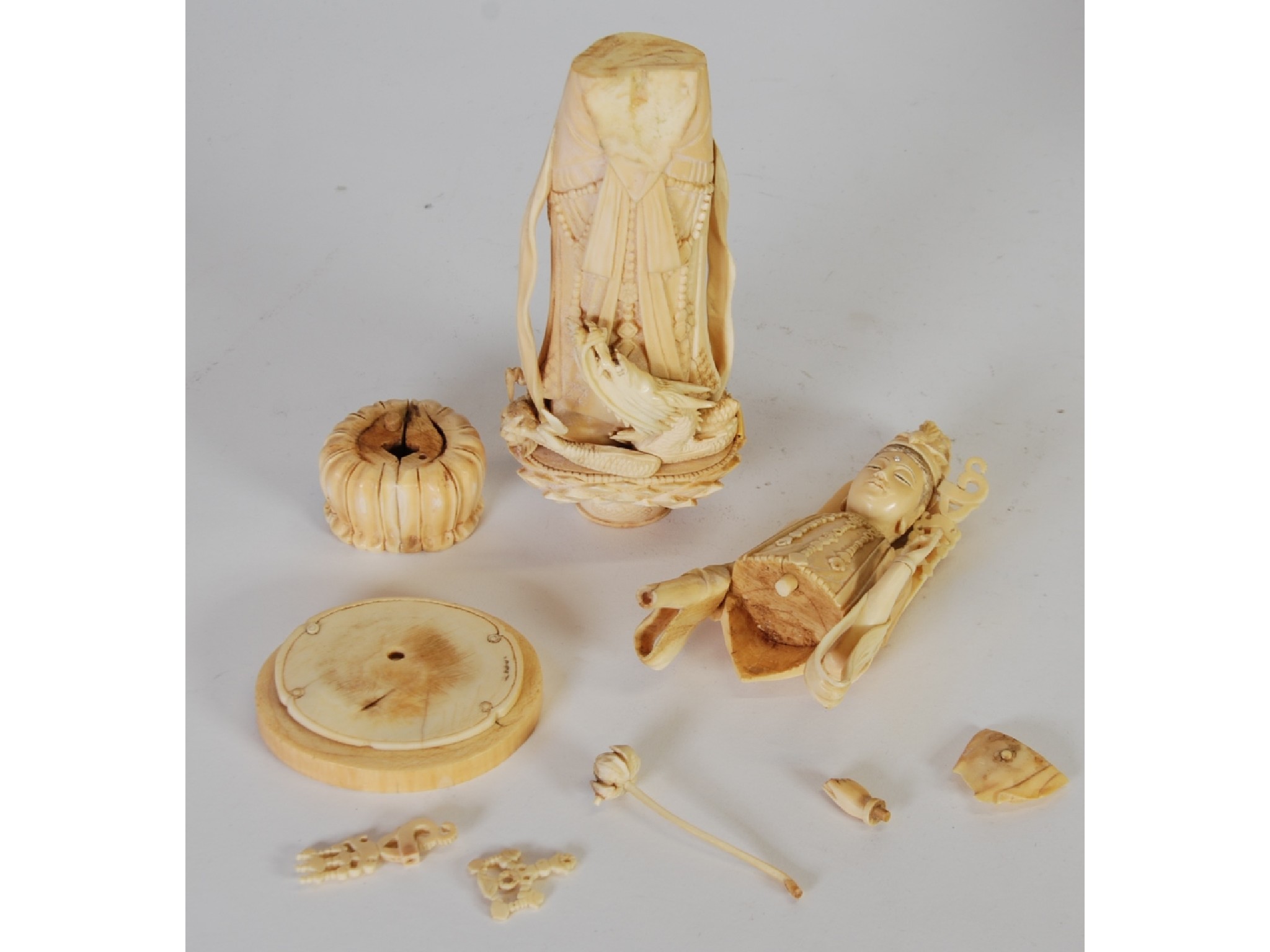 Appraisal: AN ORIENTAL CARVED SECTIONAL IVORY FIGURE OF GUAN YIN dressed