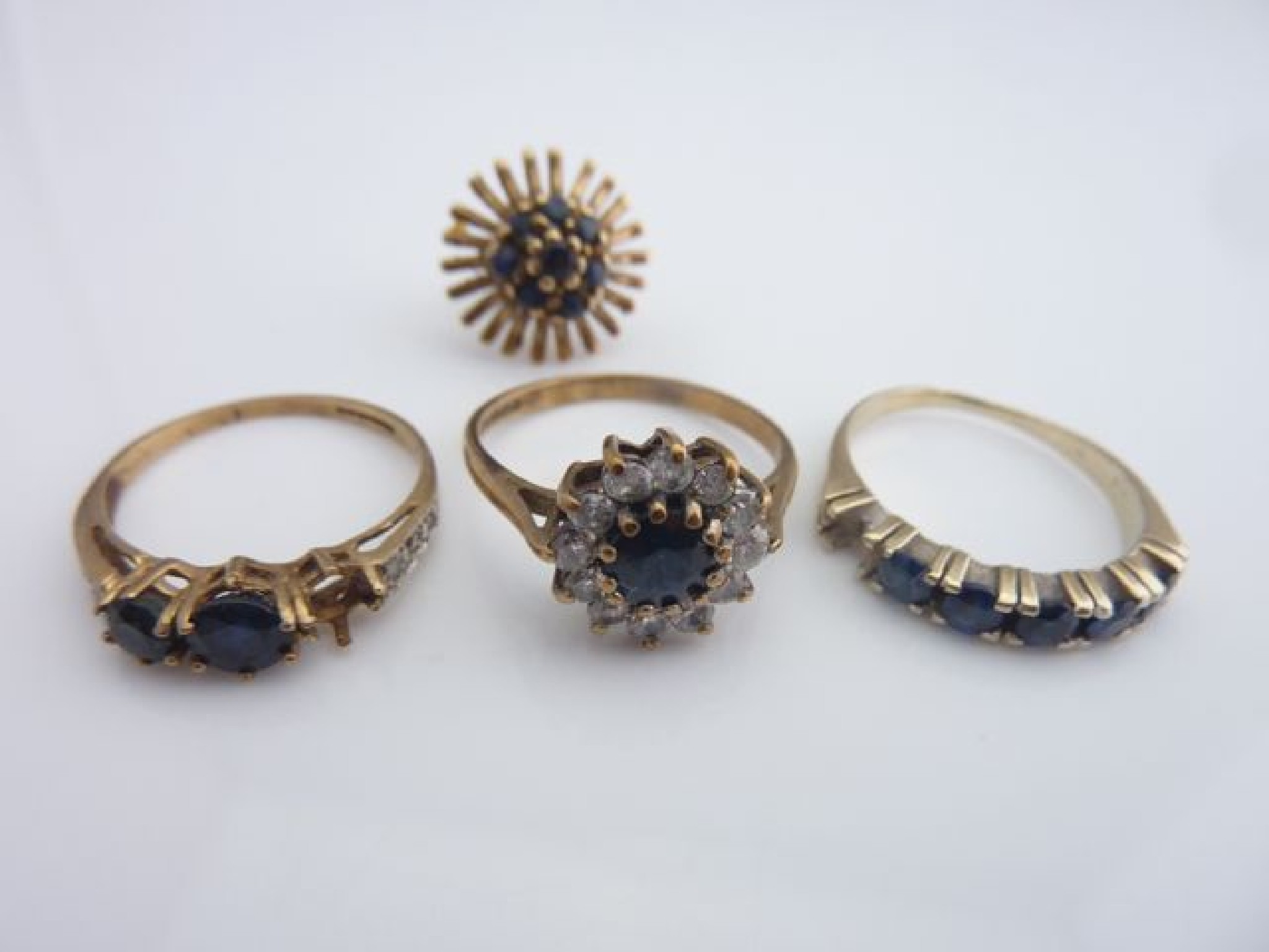 Appraisal: A sapphire cluster ring centred with a round mixed-cut untested