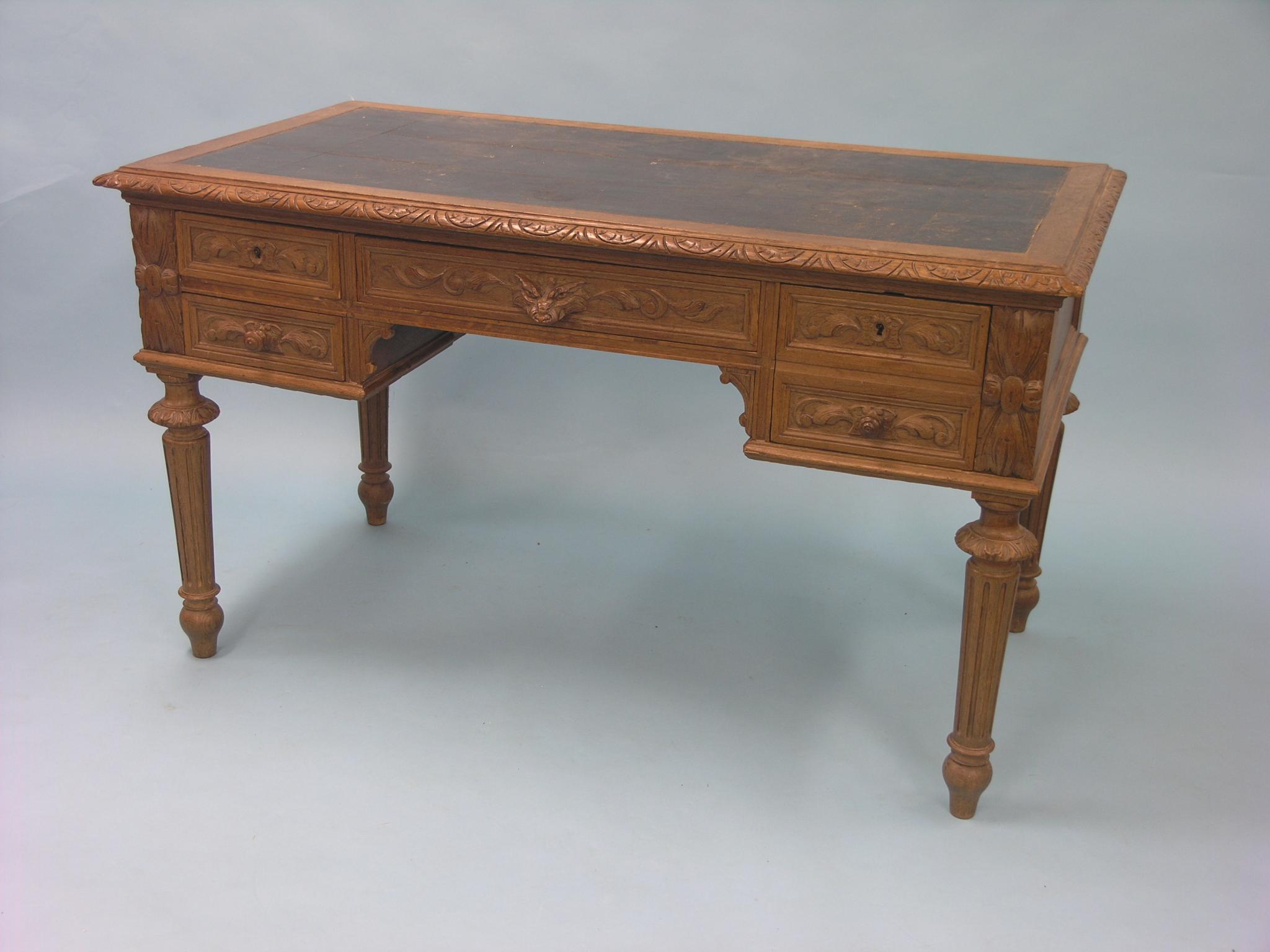 Appraisal: A late th century French carved oak desk inset vinyl