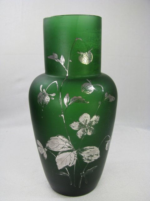 Appraisal: Dark green glass vase with a floral silver overlay Measures