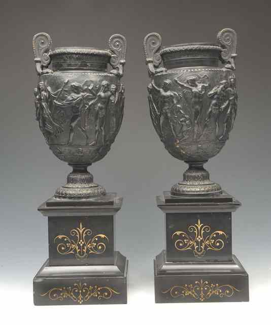 Appraisal: A PAIR OF BRONZED VASES after the antique on polished