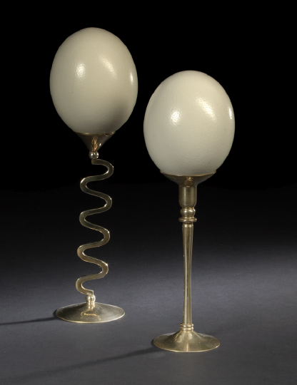 Appraisal: Two Brass-Mounted Ostrich Egg Garnitures one egg mounted on a