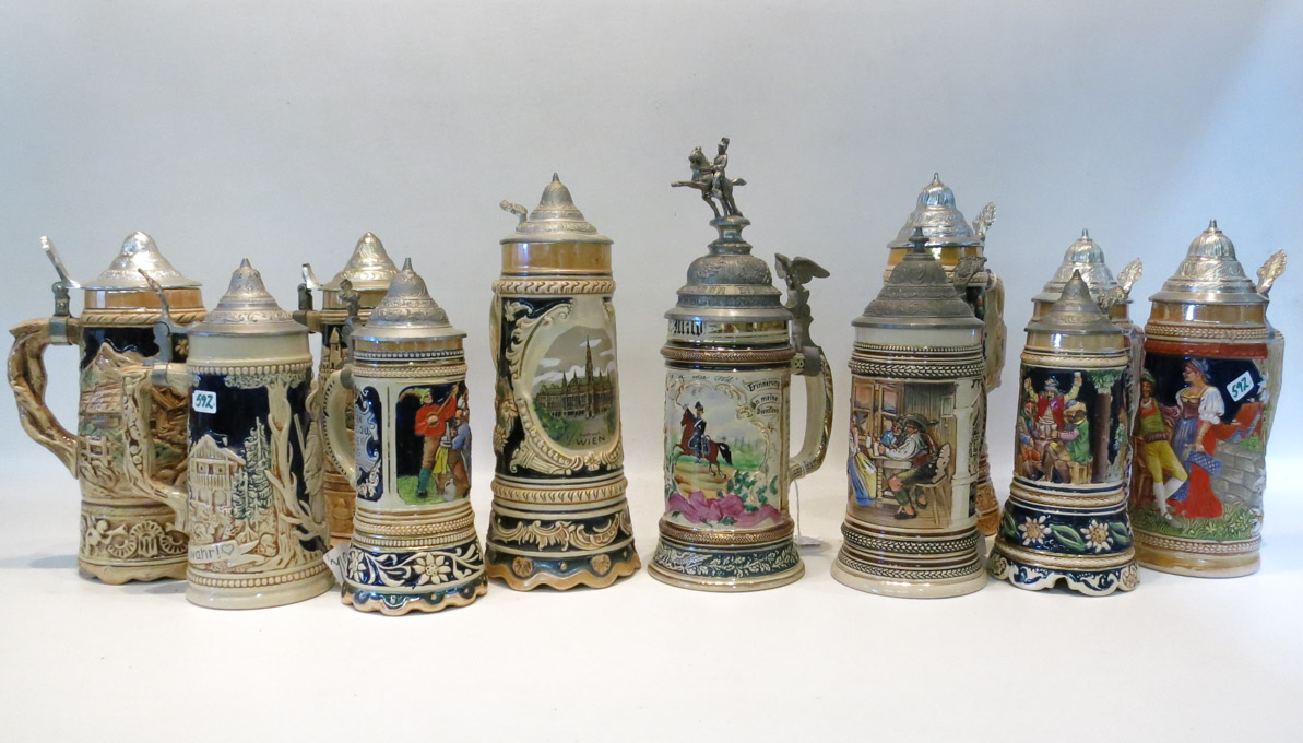 Appraisal: ELEVEN GERMAN EARTHENWARE STEINS with hinged metal lids various makers