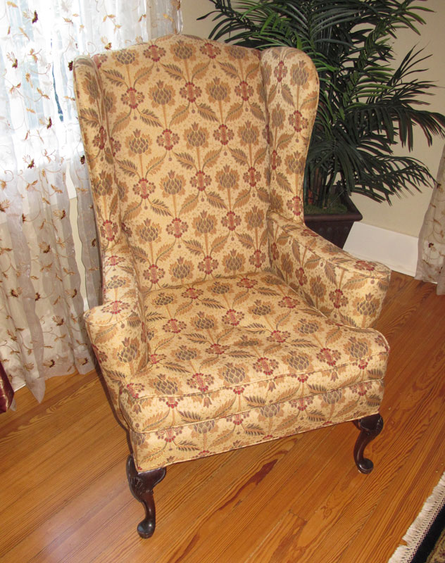 Appraisal: FLORAL WING BACK CHAIR Floral upholstery carved and shaped legs