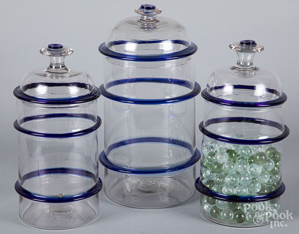 Appraisal: Three clear and cobalt glass apothecary jars Three clear and