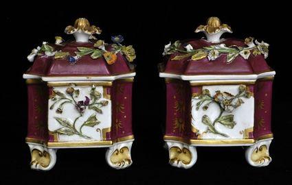 Appraisal: PAIR OF ENGLISH PORCELAIN FLORAL-ENCRUSTED INKSTANDS AND COVERS Each maroon-ground