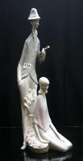 Appraisal: A Lladro figural group depicting a musician and a girl