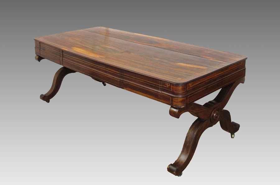 Appraisal: ROSEWOOD DESK TABLE String inlay in a richly grained wood