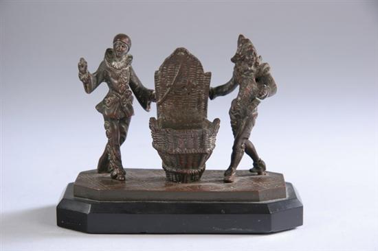 Appraisal: CONTINENTAL BRONZE FIGURAL MATCHSTICK HOLDER late th century Depicting two