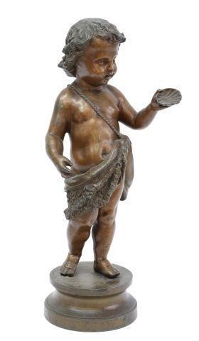 Appraisal: Patinated metal sculpture standing draped putto holding seashell rising on