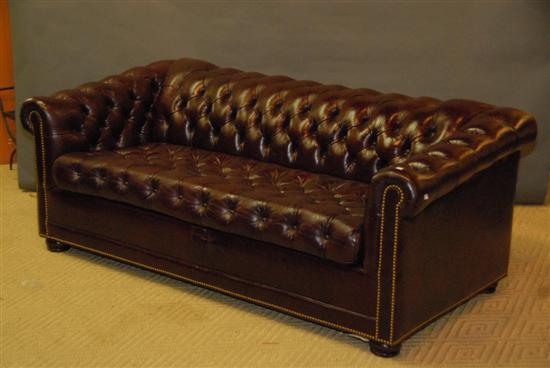 Appraisal: HANCOCK AND MOORE CHESTERFIELD-STYLE BURGUNDY LEATHER SOFA BED l Provenance