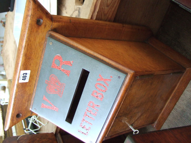 Appraisal: An oak framed hanging letter box the slope front with