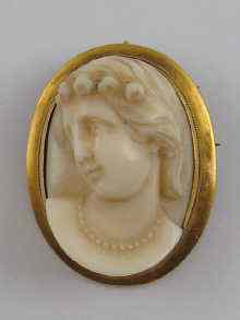 Appraisal: A finely carved ivory cameo set in yellow metal tests