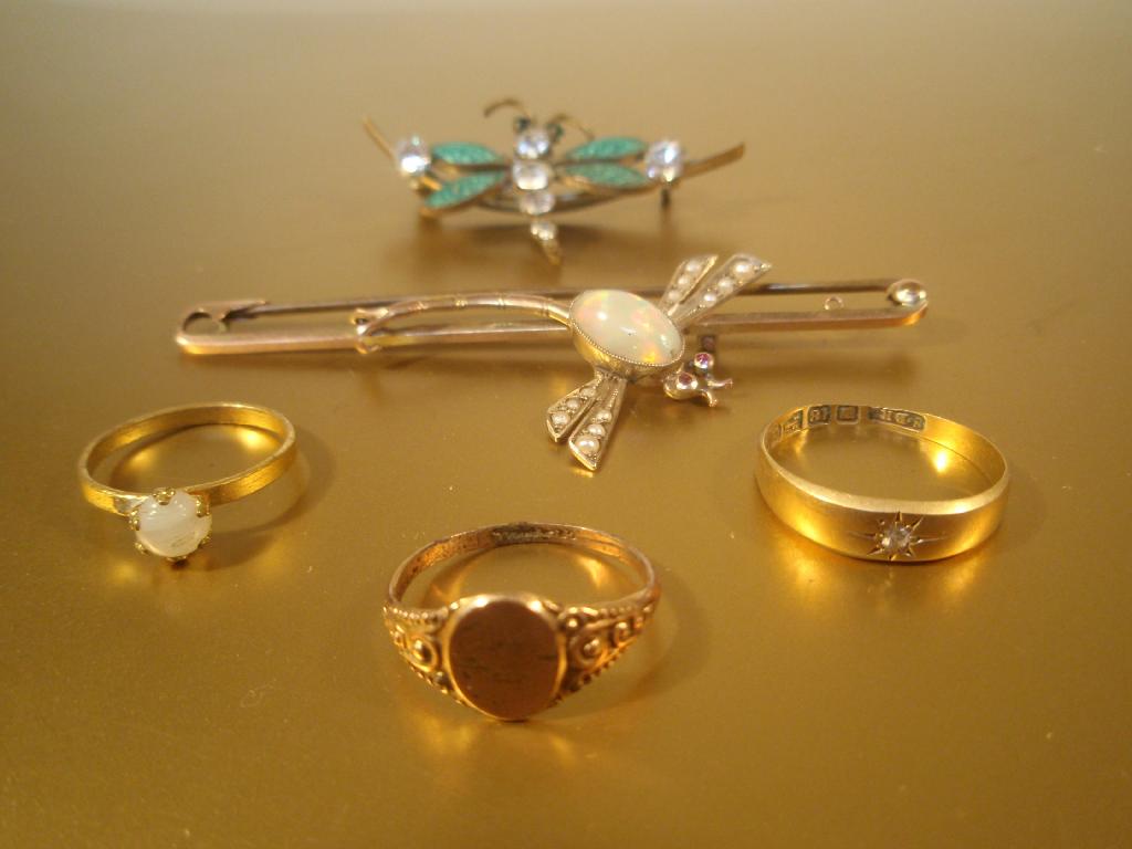 Appraisal: Three gold rings various grades and two bug brooches AF