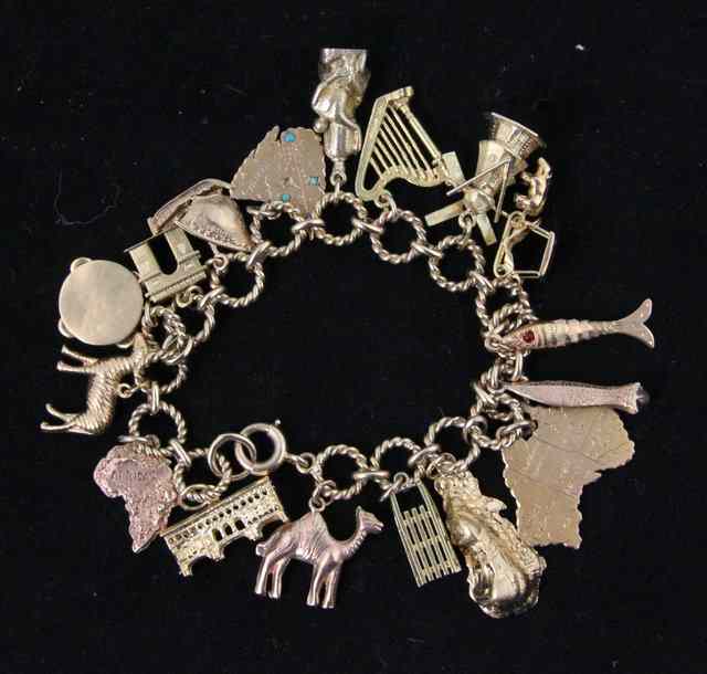 Appraisal: A ct gold charm bracelet hung with a variety of