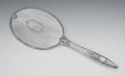 Appraisal: A Sterling Silver Neoclassical Hand Mirror Oval shape with long