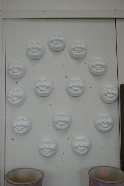 Appraisal: COLLECTION OF SARSAPARILLA PORCELAIN MOON FACE PLAQUES