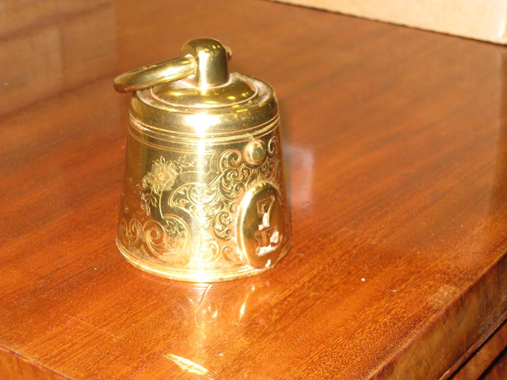 Appraisal: A brass Inkwell in the form of a lb weight