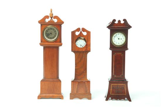 Appraisal: THREE WATCH HUTCHES American th century Miniature tall case clocks