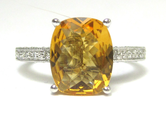 Appraisal: CITRINE DIAMOND AND FOURTEEN KARAT GOLD RING The white gold