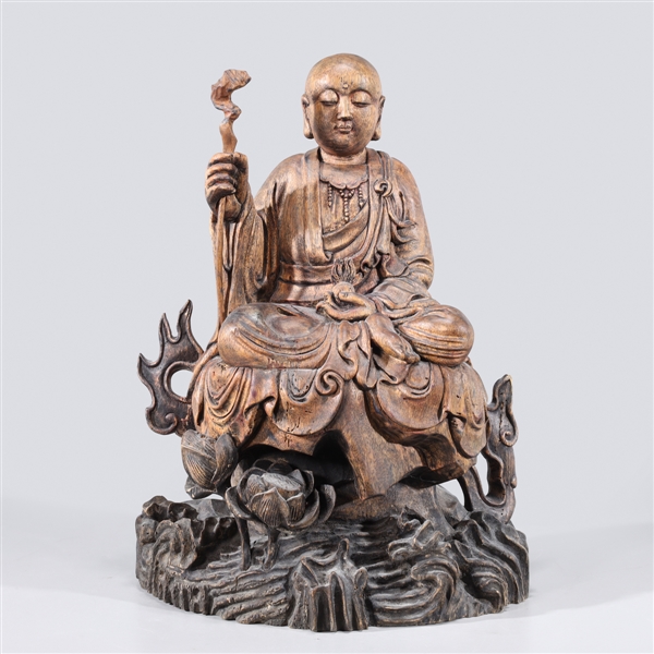 Appraisal: Finely carved Chinese wooden statue of Buddha with staff and