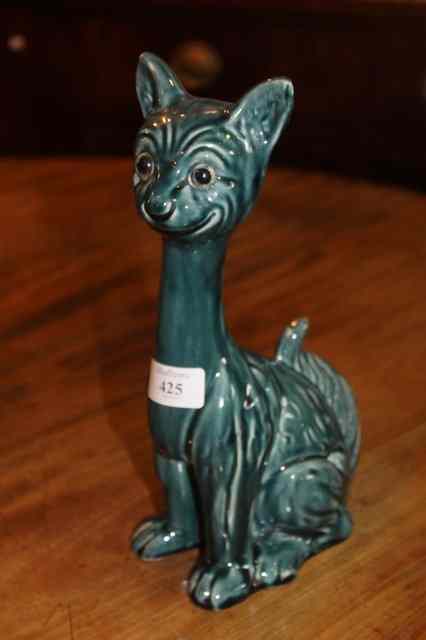 Appraisal: A POTTERY GLAZED CAT in the manner of Gall high