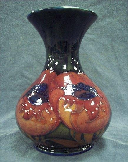 Appraisal: A Poppy pattern vase of dark blue ground with flanged