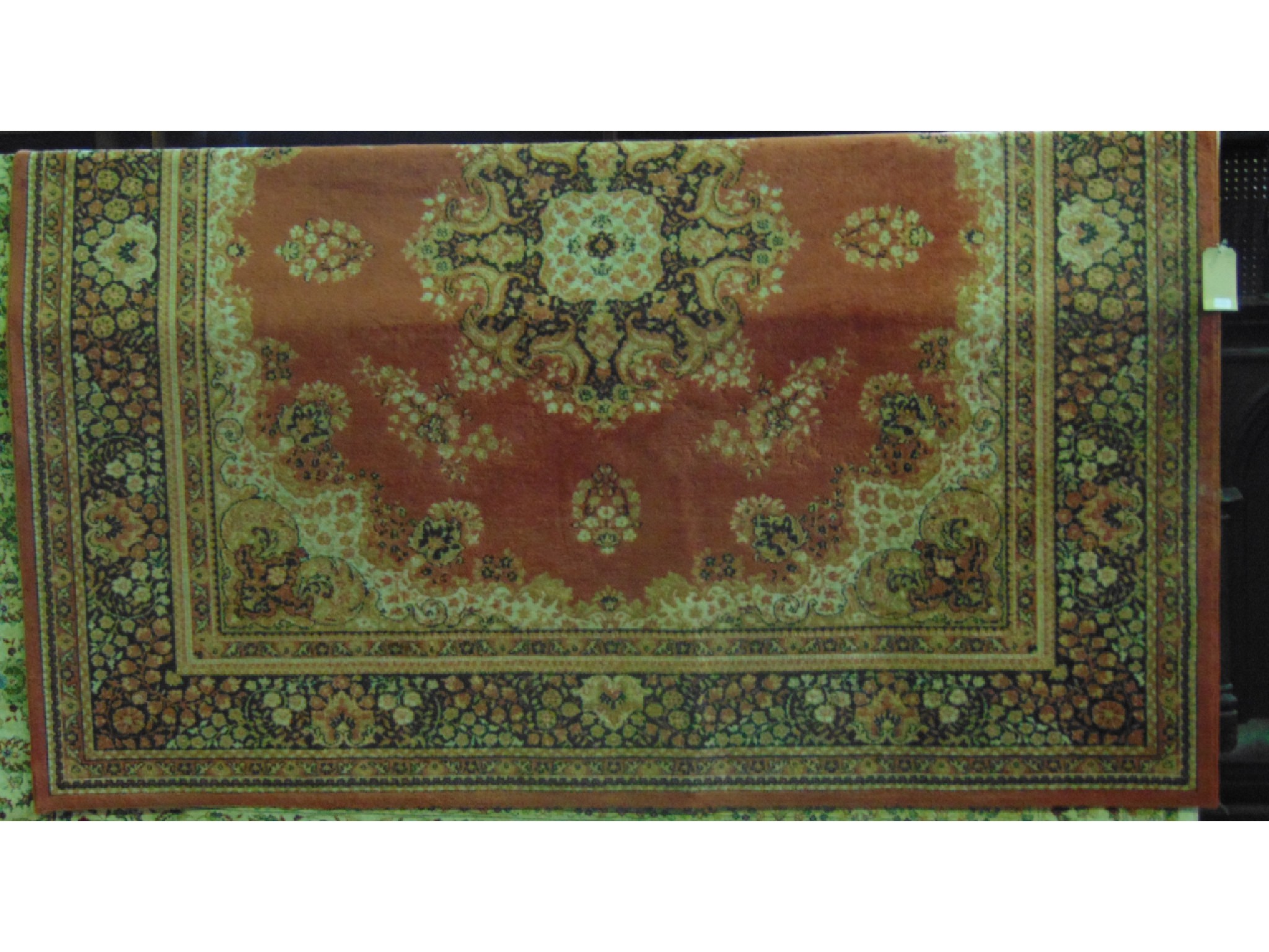 Appraisal: An large wool carpet the central pink field interspersed with