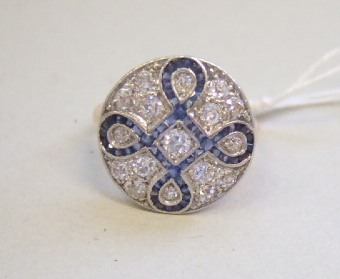 Appraisal: A sapphire and diamond set circular cluster ring mounted with