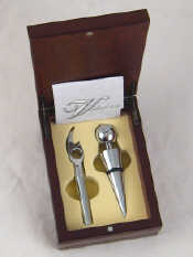 Appraisal: A barman's set of corkscrew bottle opener and stopper in