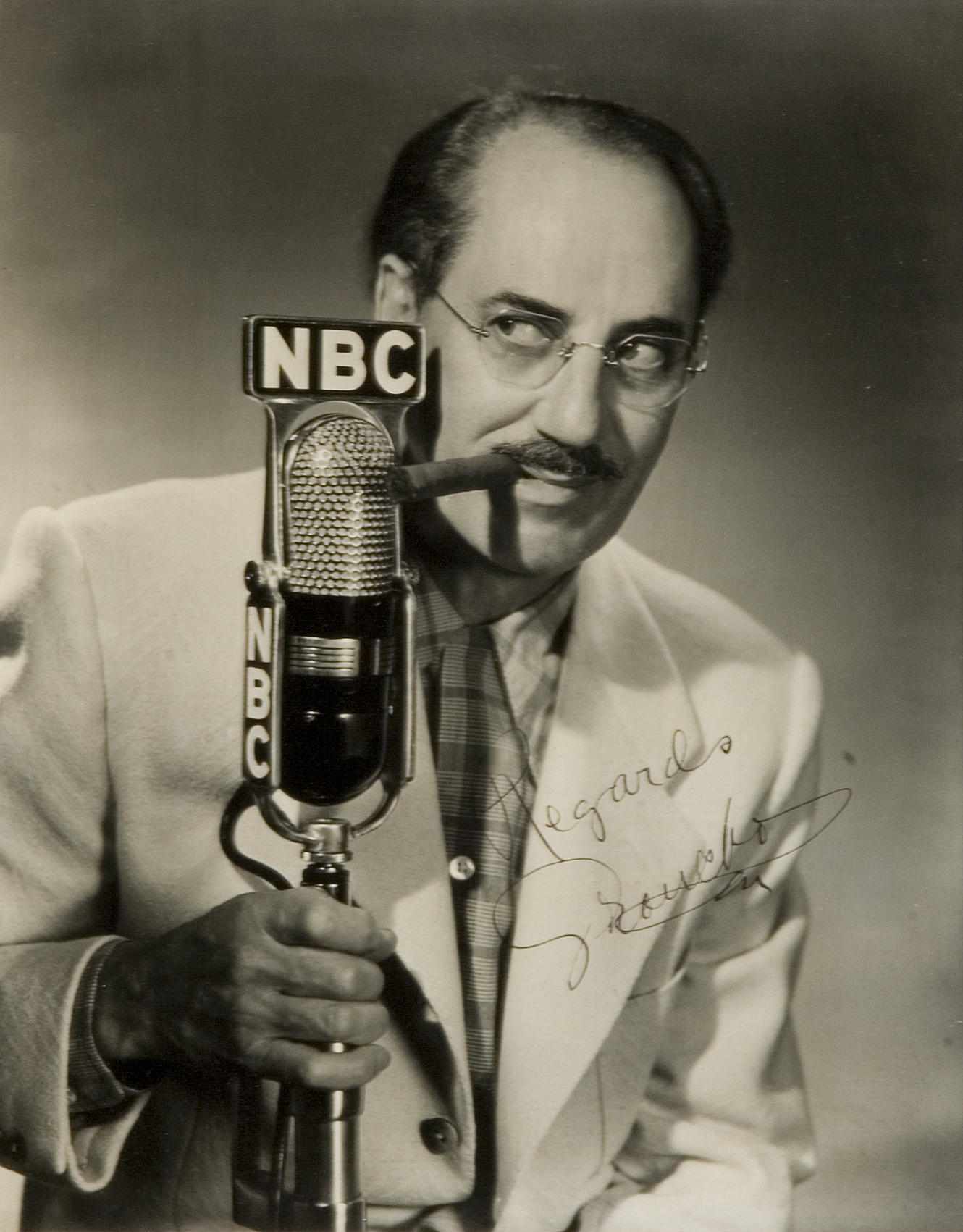 Appraisal: A Groucho Marx signed photograph A gelatin silver print of