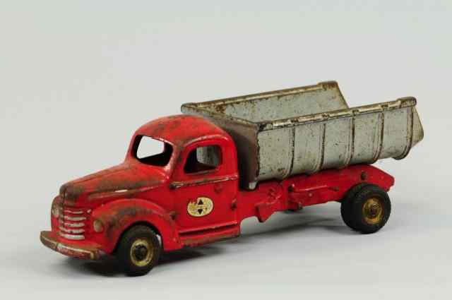 Appraisal: INTERNATIONAL DUMP TRUCK Arcade cast iron enclosed red cab with