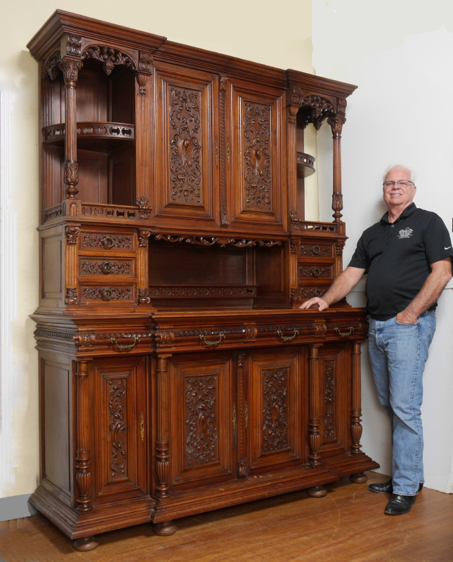 Appraisal: PROFUSELY CARVED GOTHIC REVIVAL SIDEBOARD Stepped pediment over central doors