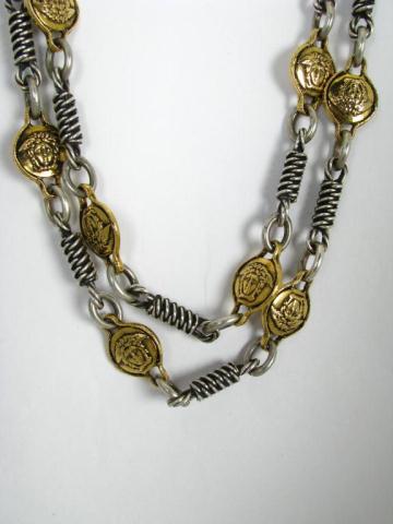 Appraisal: Versus by Gianni Versace silver and gold color coil link