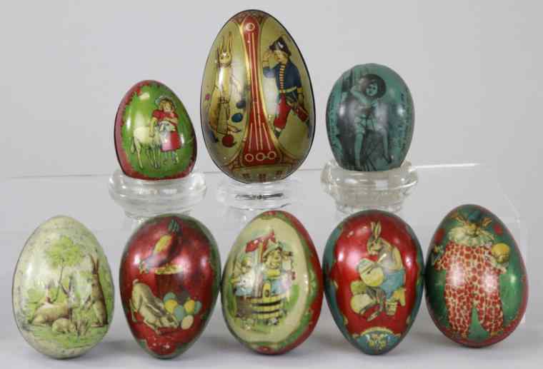 Appraisal: EIGHT EASTER EGG CANDY CONTAINERS Tin polychromed with children's nursery