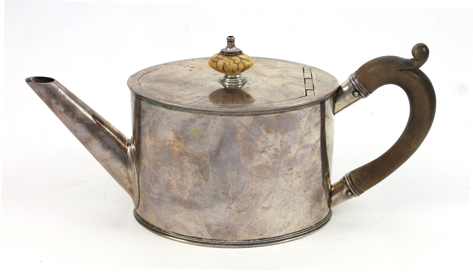 Appraisal: A George III small oval silver teapot of plain form