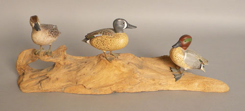 Appraisal: Three miniature duck decoys th c mounted to driftwood branded