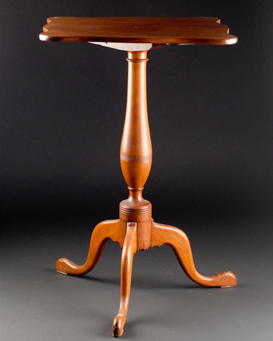 Appraisal: An E th C Cherry Tilt-top Candlestand having a shaped