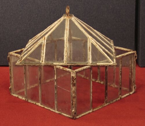 Appraisal: A glazed cast iron miniature greenhouse of rectangular form the