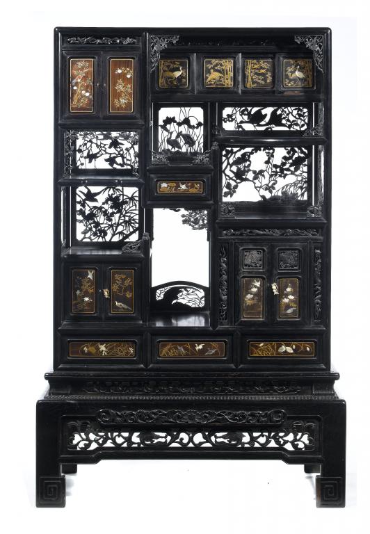 Appraisal: A JAPANESE EBONISED HARDWOOD AND LACQUER CABINET of asymmetric design