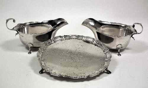 Appraisal: A pair of Edward VII silver oval sauce boats with