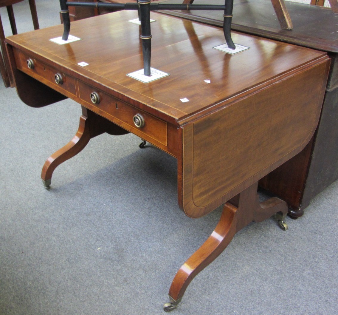 Appraisal: A George III mahogany sofa table with pair of frieze