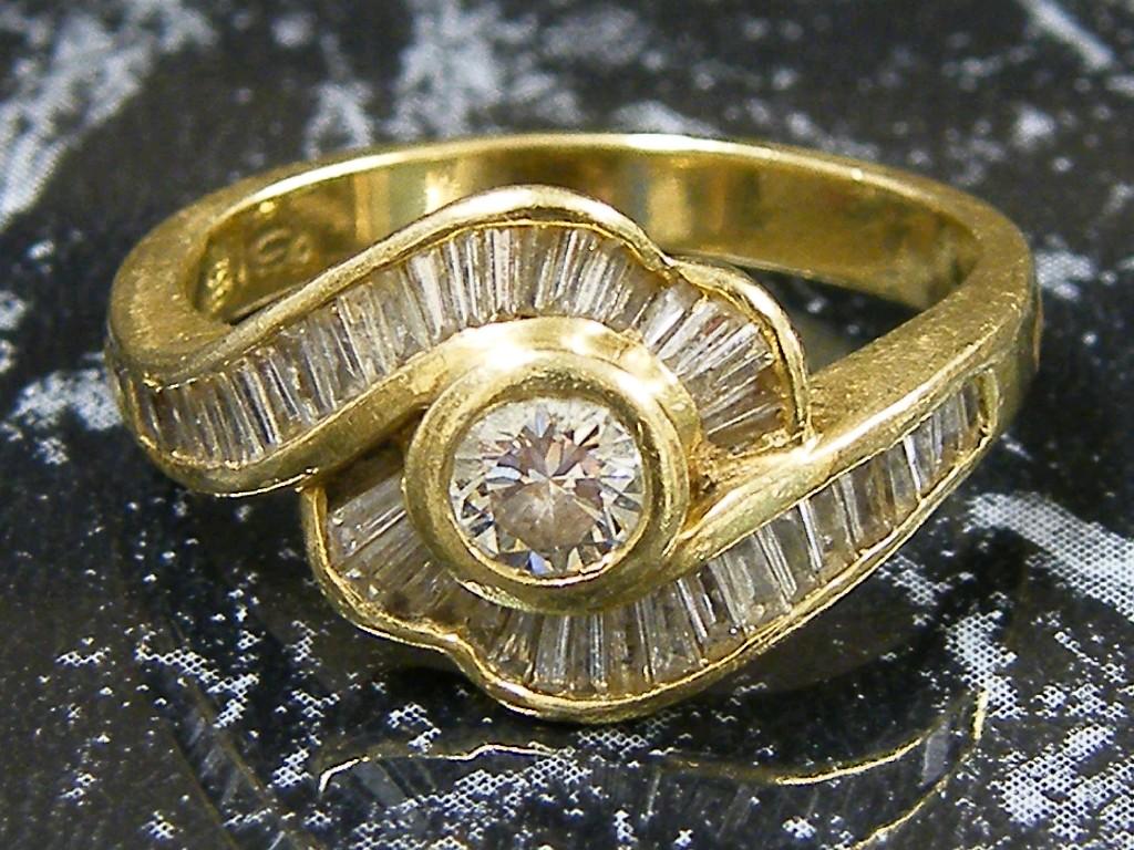 Appraisal: ct diamond baguette and brilliant cut crossover design ring centre