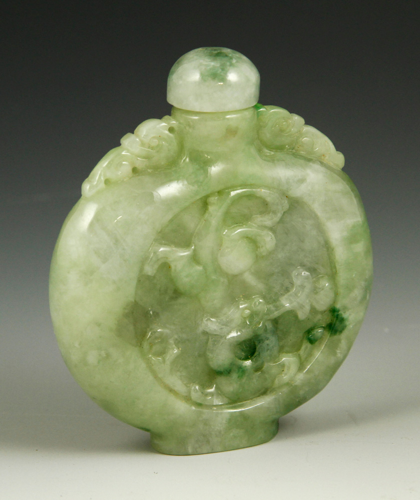 Appraisal: - Chinese Carved Jadeite Snuff Bottle Carved jadeite snuff bottle