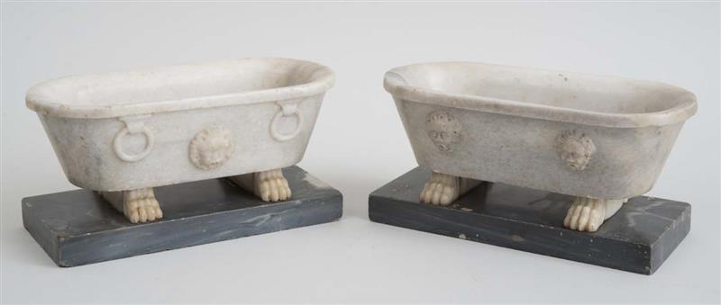 Appraisal: NEAR PAIR OF ITALIAN MARBLE FARNESE TUBS Raised on a