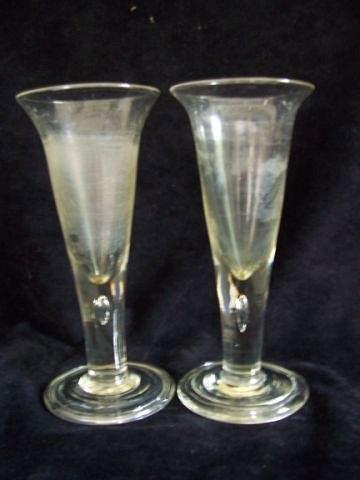 Appraisal: A pair of drawn stem glasses each set a teardrop