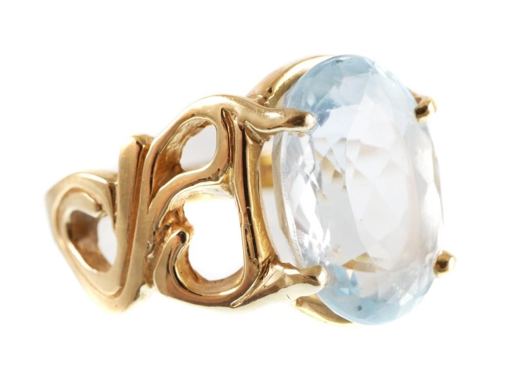 Appraisal: K yellow gold ring contains one oval faceted Sky blue