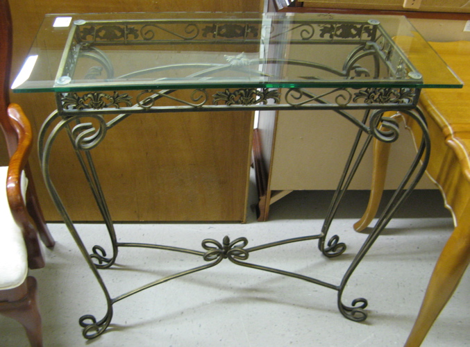 Appraisal: GLASS-TOPPED WROUGHT IRON CONSOLE TABLE American th century The rectangular