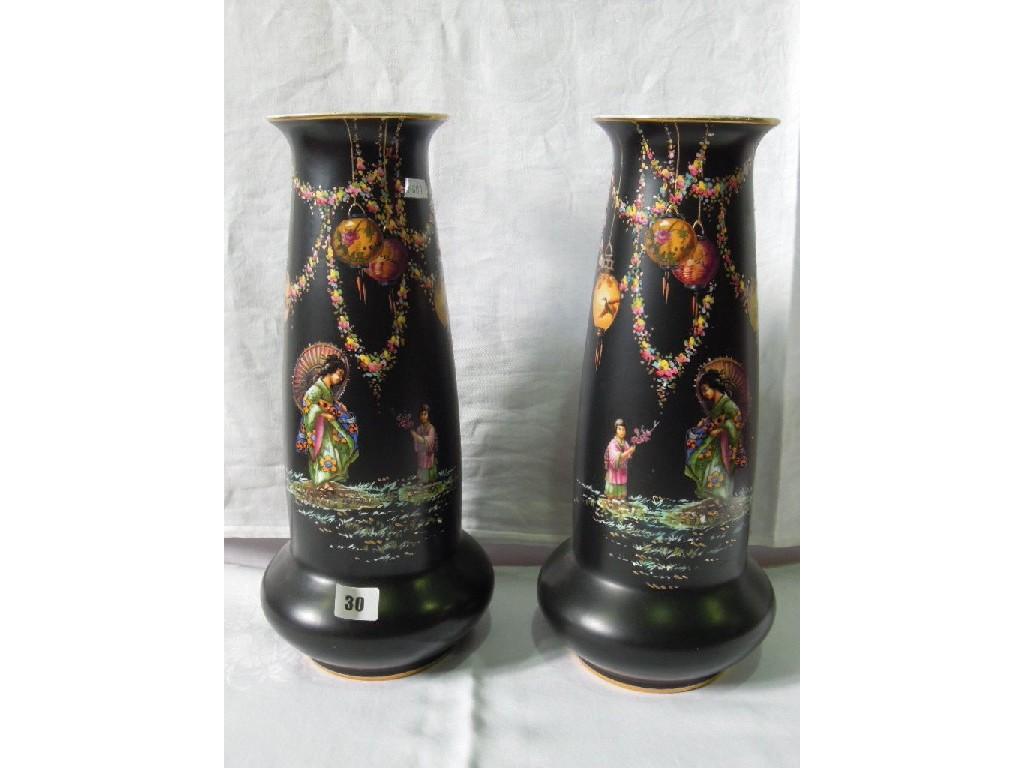 Appraisal: A pair of black vases decorated with oriental figures and