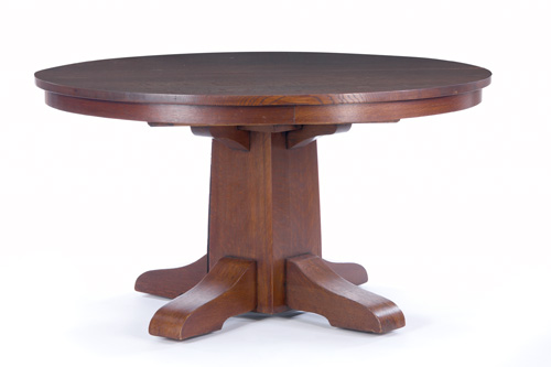 Appraisal: GUSTAV STICKLEY Dining table with a shaped pedestal three original